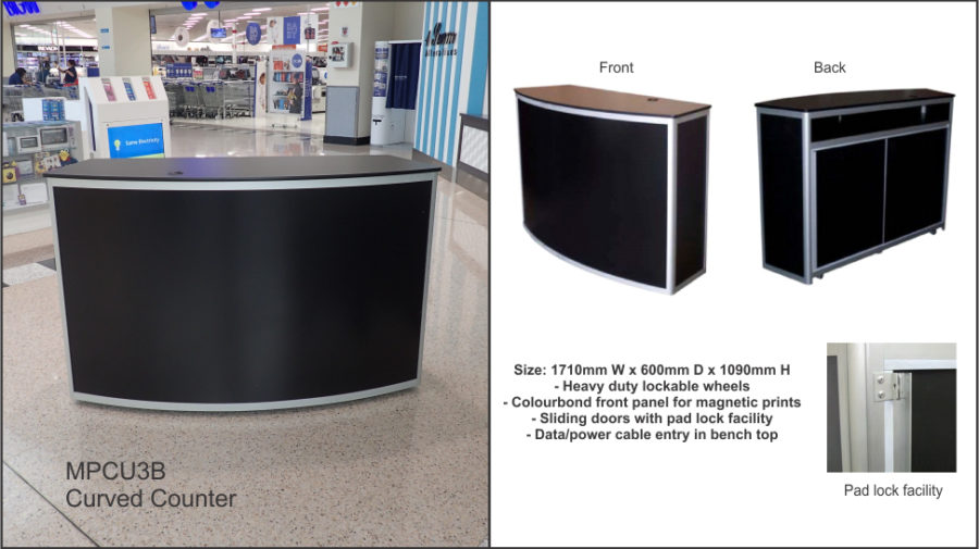 MPCU3B Curved front counter unit (large) in black with • clear anodised frame. Colorbond front panel for client graphics. Parcel shelf to rear. Cable port. Lockable castor wheels to base. Sliding doors to rear with padlock facility.